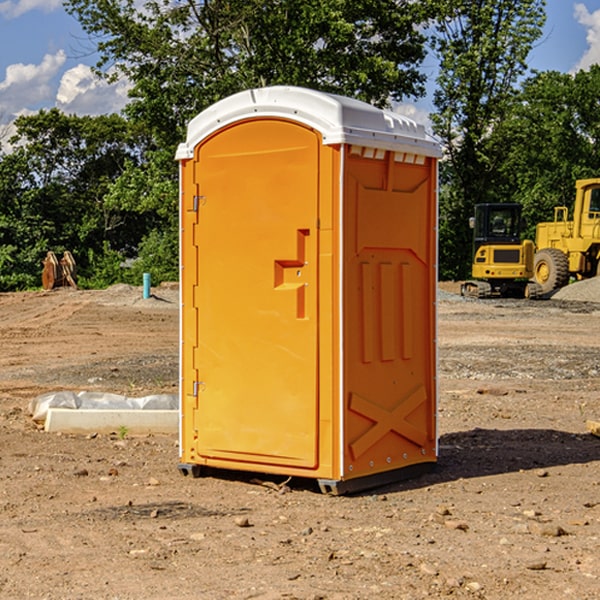 what is the cost difference between standard and deluxe portable restroom rentals in Broughton